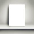 Blank White Poster Mock Up on White Shelf Royalty Free Stock Photo