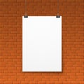 Blank white poster on red brick wall Royalty Free Stock Photo