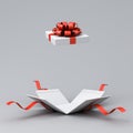 Blank white present box open or opened gift box with red ribbons and bow on white grey background with shadow minimal Royalty Free Stock Photo