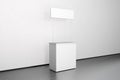 Blank white promo counter mockup stand near the wall, side