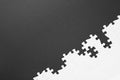 Blank white puzzle pieces on black background. Space for text Royalty Free Stock Photo