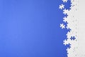 Blank white puzzle pieces on blue background. Space for text Royalty Free Stock Photo