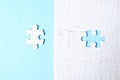 Blank white puzzle with separated piece on light blue background Royalty Free Stock Photo