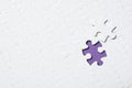 Blank white puzzle with separated piece on purple background. Space for text Royalty Free Stock Photo
