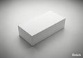 A blank white rectangular box sits on a textured white background isolated on white background Royalty Free Stock Photo