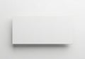 A blank white rectangular card casting a subtle shadow isolated on white background Royalty Free Stock Photo