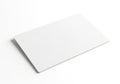 A blank white rectangular card casting a subtle shadow isolated on white background Royalty Free Stock Photo