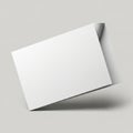 Blank white rectangular card leaning against a subtle shadow on a clean white background isolated on white background Royalty Free Stock Photo