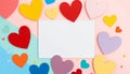 blank white rectangular card surrounded by colorful paper hearts on a pastel split background Royalty Free Stock Photo