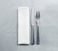 Blank white restaurant napkin mockup with knife and fork