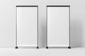 Two blank roll-up banners next to each other on a white background Royalty Free Stock Photo