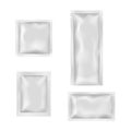 Blank white sachets for wet wipes, sauces or spices, easy tear sealed, rectangular plastic packages Royalty Free Stock Photo