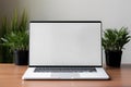 Blank white screen with laptop computer mockup isolated on office desk background Royalty Free Stock Photo