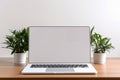 Blank white screen with laptop computer mockup isolated on office desk background Royalty Free Stock Photo