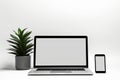 Blank white screen with laptop computer mockup isolated on office desk background Royalty Free Stock Photo