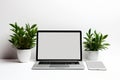 Blank white screen with laptop computer mockup isolated on office desk background Royalty Free Stock Photo