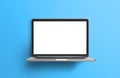 Blank white screen of laptop on sky blue background Royalty Free Stock Photo