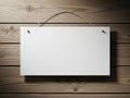 Blank white sign hanging on rustic wooden wall with natural texture and hanging string Royalty Free Stock Photo
