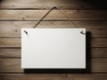 Blank white sign hanging on rustic wooden wall with natural texture Royalty Free Stock Photo