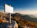 Blank white sign on a mountain with sky background Royalty Free Stock Photo
