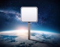 Blank white sign on planet Earth with outer space background Royalty Free Stock Photo