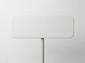 A blank white sign on a pole against a plain white background, ideal for mockup and design purposes Royalty Free Stock Photo