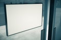 Blank white signboard on glassy door of building