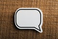 Blank White Speech Bubble Paper On Wooden Background