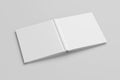 Blank white square open and upside down book cover on white background isolated with clipping path around cover. Royalty Free Stock Photo