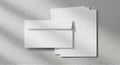 Blank white stationery set with envelope and paper sheets Royalty Free Stock Photo