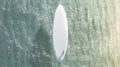 Blank white surfboard with fins on water surface mock up