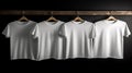 Blank white t-shirts set hanging on hangerâs mockup dark black background Royalty Free Stock Photo