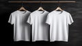 Blank white t-shirts set hanging on hangerâs mockup dark black background Royalty Free Stock Photo