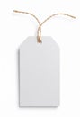 Blank white tag with jute twine isolated on white background. Royalty Free Stock Photo