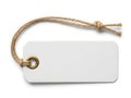 A blank white tag tied with a piece of natural colored string Royalty Free Stock Photo