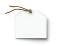 a blank white tag, tied with a rustic string, lies on a clean surface