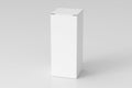 Blank white tall and slim gift box with closed hinged flap lid on white background. Clipping path around box mock up.