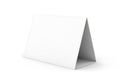 Blank white tent card standing on a white surface ready for custom design Royalty Free Stock Photo