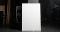 Blank White Vertical Board in Dark Studio Setting Royalty Free Stock Photo
