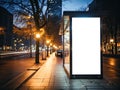 Blank white vertical digital billboard poster on city street bus stop sign at nigh. Street advertising bus stop mockup.Generative Royalty Free Stock Photo