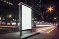 Blank white vertical digital billboard poster on city street bus stop sign at night. AI generated Royalty Free Stock Photo