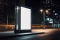 Blank white vertical digital billboard poster on city street bus stop sign at night. AI generated Royalty Free Stock Photo