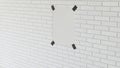 Blank white vertical poster taped to the brick wall Royalty Free Stock Photo