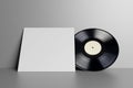 Blank white vinyl LP record on white wall. 3D rendering