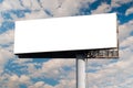Blank wide white billboard against the blue sky with white clouds - mock up Royalty Free Stock Photo