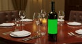 Blank Wine Bottle Label Mockup on a Restaurant Table Royalty Free Stock Photo
