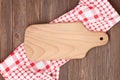 Blank wood cutting board on the kitchen table, flat lay Royalty Free Stock Photo
