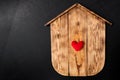 Blank Wood House with heart on the background of green grass Royalty Free Stock Photo