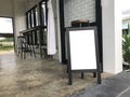Blank wood sandwich board standing outdoor cafe. empty chalkboard for mockup menu advertising design. Royalty Free Stock Photo