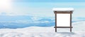 Blank wooden billboard, signpost in front of a mountain landscape with snow.  surface for mockup Royalty Free Stock Photo